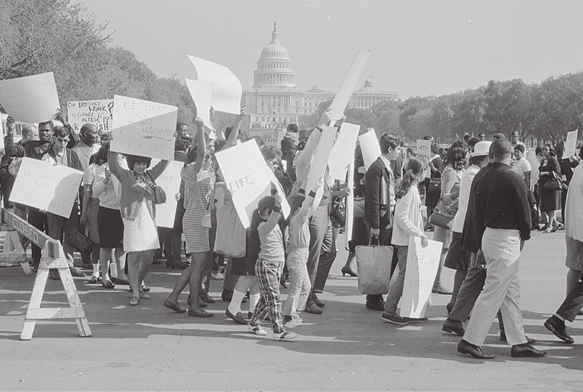 Demonstrators with signs on the National Mall in Washington, D.C., 1960s