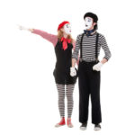 portrait of mimes. woman pointing at something. isolated on white background
