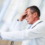Stressed out doctor worried about his patient.  [url=http://www.istockphoto.com/search/lightbox/9786662][img]http://dl.dropbox.com/u/40117171/medicine.jpg[/img][/url]