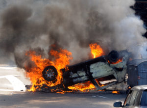 Burned car at street riots