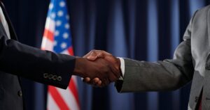 black men handshake politicians congress