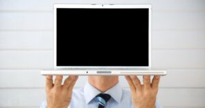 businessman hiding behind computer screen virtual meeting